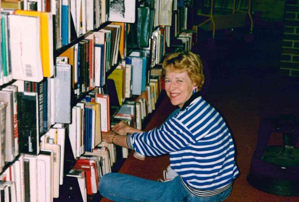 image of joan in the library stacks