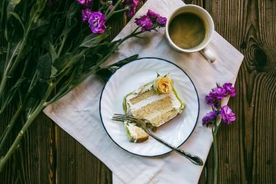 Photo of coffee and cake on a plate with flowers by Alisa Anton on Unsplash